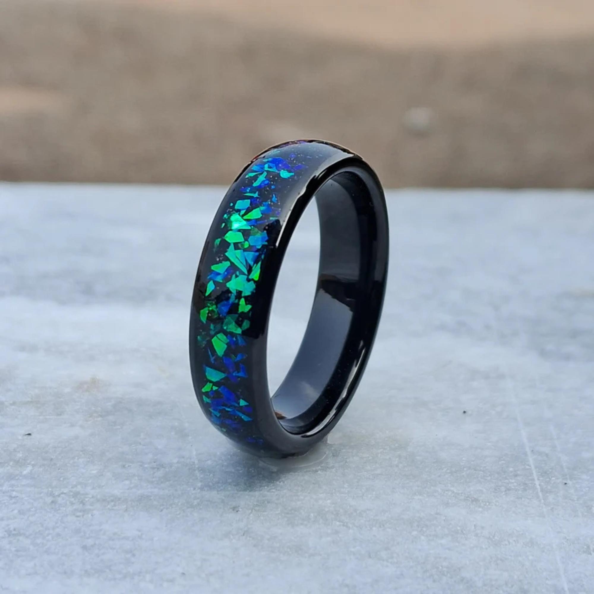 This 6mm Men's Tungsten Ring features a polished finish and stunning galaxy created opal inlay, offering a unique and stylish accessory