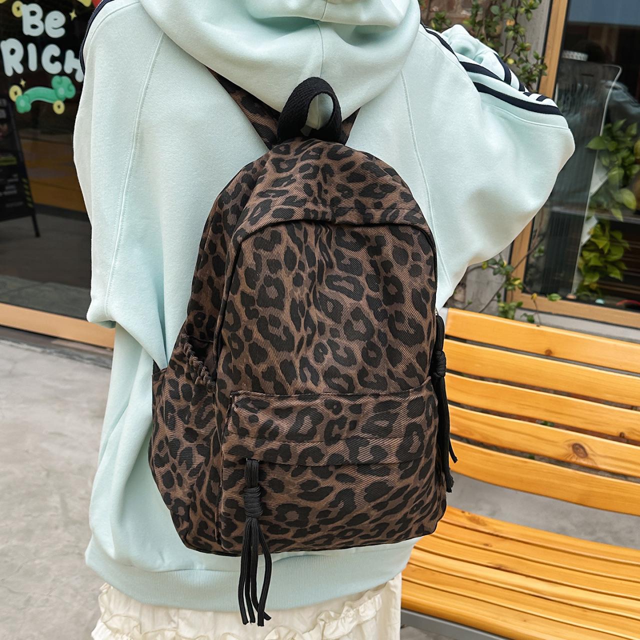 Рюкзак с леопардовым принтом Повседневный Модный уличный стиль Легкий рюкзак для женщин с деталью в виде кисточки для школы, путешествий и повседневных прогулок